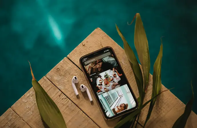 black iphone 5 on brown wooden table